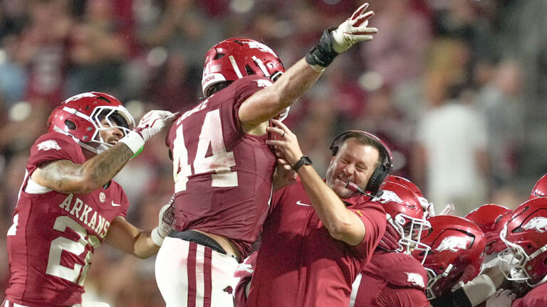 Arkansas Razorbacks linebacker Ben Bogle and coach Ryan Silverfield after a stop against the Tulsa Golden Hurricane at Razorback Stadium