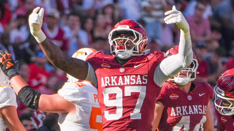 Arkansas Razorbacks defensive lineman Quincy Rhodes celebrates after returning a fumble against the Tennessee Volunteers at Razorback Stadium