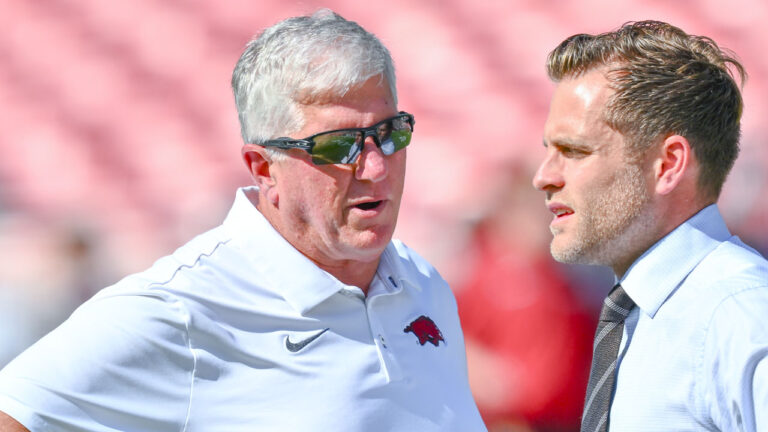 Arkansas Razorbacks defensive coordinator Ron Roberts on the field in warmups before game against the Tennessee Volunteers at Razorback Stadium