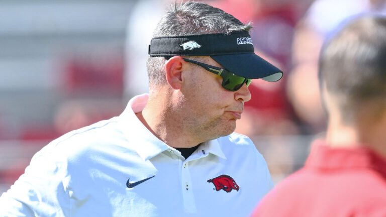 Arkansas Razorbacks offensive coordinator Tim Cramsey on the field in warmups before game against the Tennessee Volunteers at Razorback Stadium