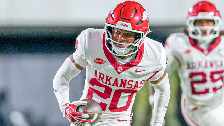 Arkansas Razorbacks defensive back Joker Johnson returns an interception for a score in a game against the Vanderbilt Commodores